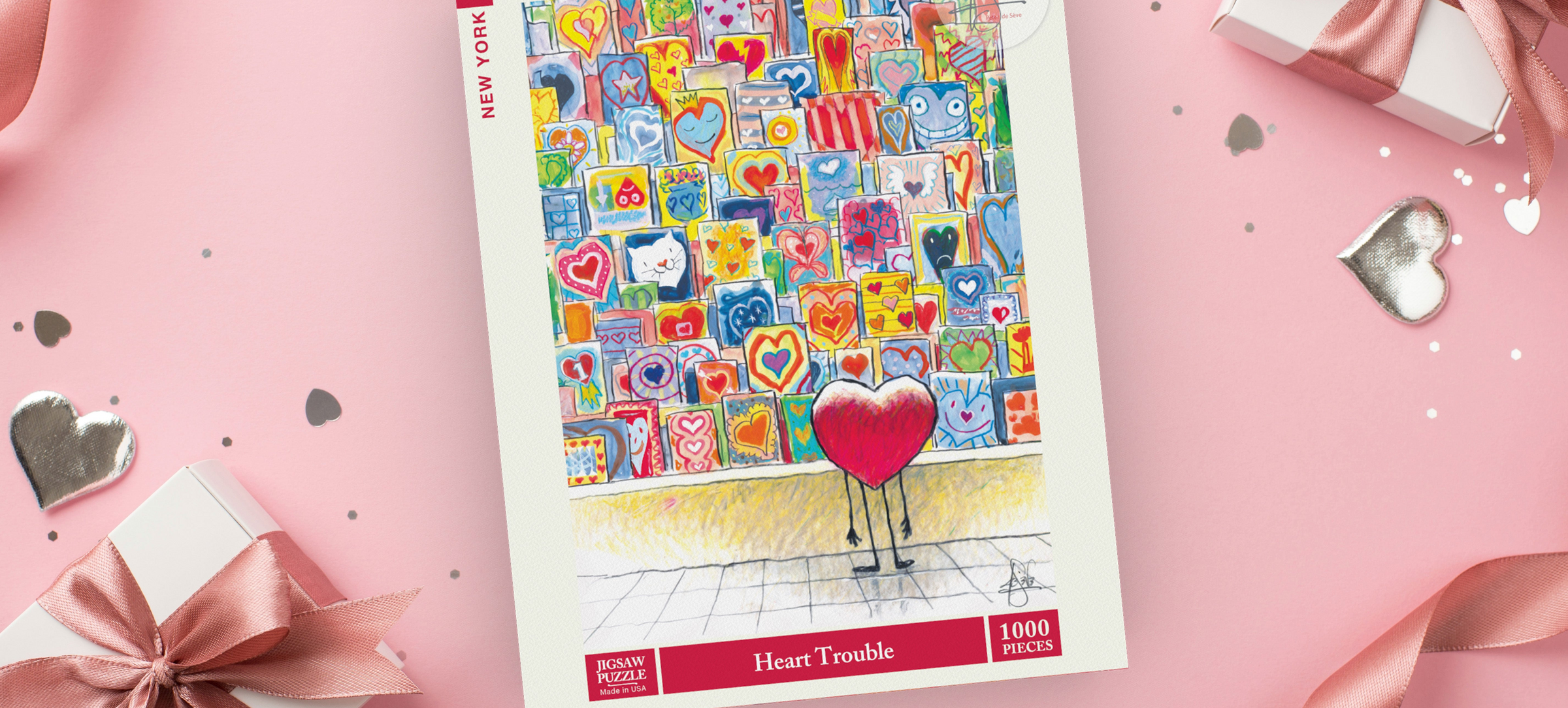 Puzzle box with colorful heart-themed design on a pink background with gift boxes and ribbons.